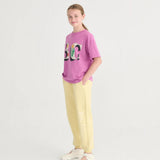 Bobo Choses Dětské kalhoty jogger s potiskem Světle žluté